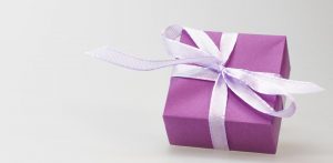 purple present with mauve ribbon