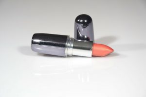 rose lipstick on white background