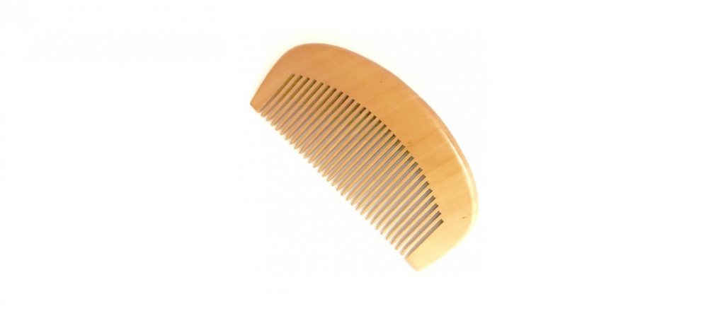 wooden comb with a white background
